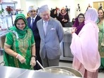 Britain's King Charles III meets volunteers who operate the 24-hour kitchen that feeds members of the local community during his visit to the newly built Guru Nanak Gurdwara, in Luton, north of London on December 6.(AFP) Britain's King Charles III meets volunteers who operate the 24-hour kitchen that feeds members of the local community during his visit to the newly built Guru Nanak Gurdwara, in Luton, north of London on December 6.(AFP)