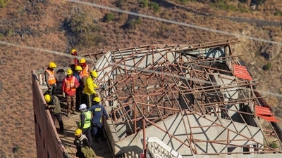 Malari Inn hotel being dismantled by SDRF personnel due to continuous land subsidence in Joshimath on Friday. (ANI) Malari Inn hotel being dismantled by SDRF personnel due to continuous land subsidence in Joshimath on Friday. (ANI)