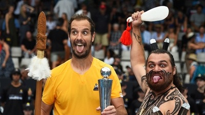 Richard Gasquet of France poses with the trophy with a local Maori perfomer (AP)