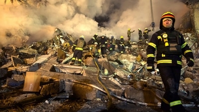 Emergency workers clear the rubble after a Russian rocket hit a multistory building leaving many people under debris in the southeastern city of Dnipro, Ukraine, Saturday,. (AP)