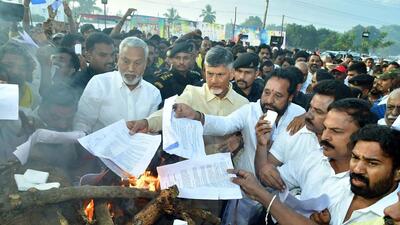 TDP president and former chief minister N Chandrababu Naidu, who took part in Bhogi festivities at his native village Naravaripalle in Chittoor district with his family members, burnt a copy of GO No. 1 in the traditional bonfire to register his protest. (ANI) TDP president and former chief minister N Chandrababu Naidu, who took part in Bhogi festivities at his native village Naravaripalle in Chittoor district with his family members, burnt a copy of GO No. 1 in the traditional bonfire to register his protest. (ANI)