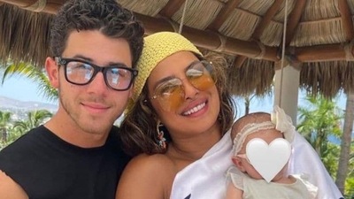 Priyanka Chopra and Nick Jonas with Malti Marie Chopra Jonas in a photo from last year.