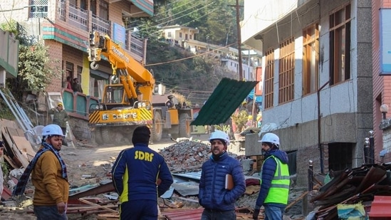 Officials prepare for the demolition of a hotel that has been marked unsafe on Saturday. (PTI)