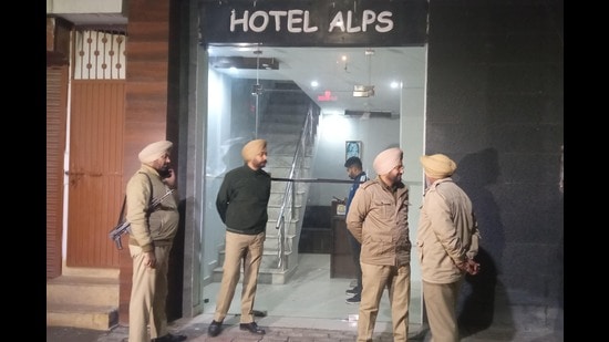Police at the Zirakpur hotel where the gangster had checked in under a fake identity. (Sant Arora/HT)