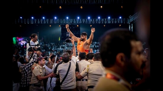 Supporters of Shivraj Rakshe (centre) celebrate after he won the Maharashtra Kesari event in Pune, on Saturday, January 14, 2023. (Pratham Gokhale/HT Photo) Supporters of Shivraj Rakshe (centre) celebrate after he won the Maharashtra Kesari event in Pune, on Saturday, January 14, 2023. (Pratham Gokhale/HT Photo)
