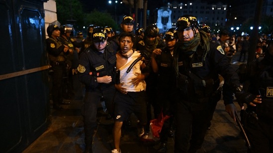 Protests In Peru: Policemen arrest a protester during a demonstration.(AFP)