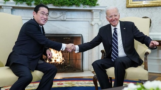 US President Joe Biden (right) shakes hands with Japan’s Prime Minister Fumio Kishida during a meeting in the Oval Office of the White House in Washington, DC on Friday. (AFP)