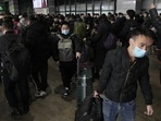 Covid In China: Travelers with their luggage arrive at a departure hall to catch their trains at the West Railway Station in Beijing.(AP) Covid In China: Travelers with their luggage arrive at a departure hall to catch their trains at the West Railway Station in Beijing.(AP)