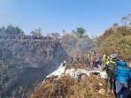 Crowds gather as rescue teams work to retrieve bodies at the crash site(via REUTERS)