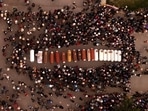 Residents surround coffins during a vigil for the more than a dozen people who died during the unrest in Juliaca, Peru. (AP) Residents surround coffins during a vigil for the more than a dozen people who died during the unrest in Juliaca, Peru. (AP)