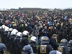 Police face protesters during a large-scale protest to stop the demolition of the village Luetzerath to make way for an open-air coal mine extension on Saturday(AFP) Police face protesters during a large-scale protest to stop the demolition of the village Luetzerath to make way for an open-air coal mine extension on Saturday(AFP)
