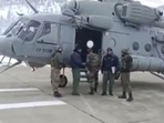 Screengrab of the video of defense officials assisting air evacuation of a pregnant woman to Srinagar on Sunday. Screengrab of the video of defense officials assisting air evacuation of a pregnant woman to Srinagar on Sunday.