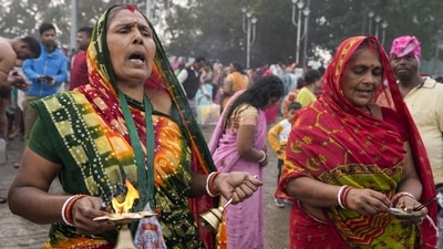 Hindu pilgrims pray after taking a ritualistic bath in Hooghly River on the occasion of Makar Sankranti festival, in Kolkata on Sunday. In honour of the Sun God, people pay homage throughout the event. Gayatri Mantra and Surya Mantra are recited in addition to Lord Sun devotion through Surya Puja and Lord Shani. (AP Photo/Bikas Das) Hindu pilgrims pray after taking a ritualistic bath in Hooghly River on the occasion of Makar Sankranti festival, in Kolkata on Sunday. In honour of the Sun God, people pay homage throughout the event. Gayatri Mantra and Surya Mantra are recited in addition to Lord Sun devotion through Surya Puja and Lord Shani. (AP Photo/Bikas Das)