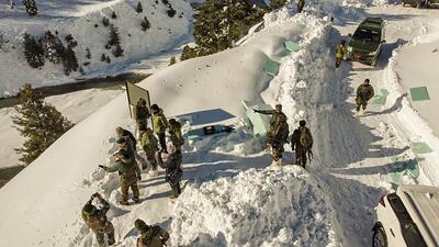 Indian Army personnel evacuate workers stranded at Zojila tunnel after a major avalanche near Sarbal Nilagrar, in Jammu and Kashmir's Ganderbal on Sunday. (PTI) Indian Army personnel evacuate workers stranded at Zojila tunnel after a major avalanche near Sarbal Nilagrar, in Jammu and Kashmir's Ganderbal on Sunday. (PTI)