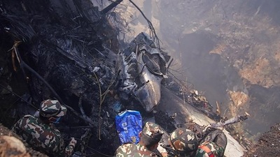 Nepal plane crash: Rescuers inspect the site of a plane crash in Pokhara on Sunday. (AFP) Nepal plane crash: Rescuers inspect the site of a plane crash in Pokhara on Sunday. (AFP)