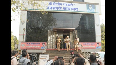 Police officials investigate after the public contact office of Nitin Gadkari received threatening calls, in Nagpur on Saturday. (PTI)