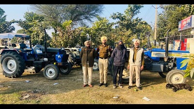 The accused and the stolen tractors recovered from him in police custody. (HT Photo)