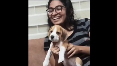 The image, taken from the video shared by Anand Mahindra, shows the dog with its pet mom. (Twitter/@anandmahindra)