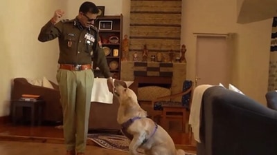The image, taken from a Twitter video, shows Meghalaya DGP with his pet dog. (Twitter/@lrbishnoiips)