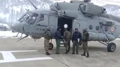 Screengrab of the video of defense officials assisting air evacuation of a pregnant woman to Srinagar on Sunday. (ANI)
