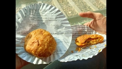 The picture, taken at Kota junction, shows kachoris resting on plates made of Chemistry paper. (Twitter/@Kulfei)