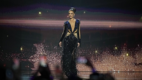 R'Bonney struts confidently on the ramp, dressed in the shimmering ensemble, for the evening gown competition during the final round of the 71st Miss Universe Beauty Pageant. (AP)