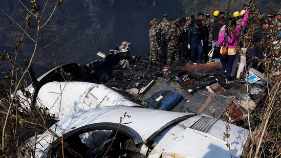 Nepal Plane Crash: Rescue teams work to retrieve bodies from the wreckage at the crash site.(Reuters)