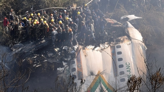 Rescue teams work to retrieve bodies from the wreckage at the crash site of an aircraft carrying 72 people in Pokhara in western Nepal January 15, 2023.(Reuters)
