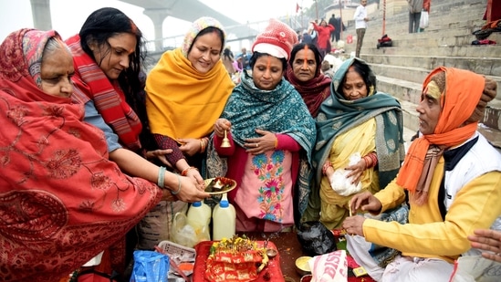 Women devotees worshipping Lord Sun through Surya Puja near Ganga ghat in Patna. The festival of Makar Sankranti, also known as Sankranthi, honours the Sun God Lord Surya and commemorates the sun's entry into the Capricorn zodiac sign (zodiac sign). (PTI photo)