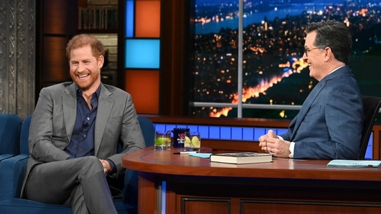 Prince Harry Latest News: Prince Harry, left, with host Stephen Colbert during a taping of "The Late Show with Stephen Colbert" on Tuesday. (CBS via AP)