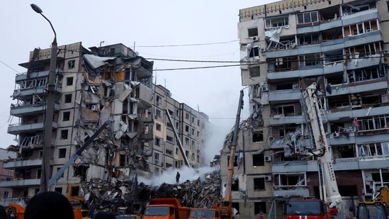 Emergency personnel work at the site where an apartment block was heavily damaged by a Russian missile strike, amid Russia's attack on Ukraine, in Dnipro, Ukraine January 15, 2023. REUTERS/Clodagh Kilcoyne(REUTERS)
