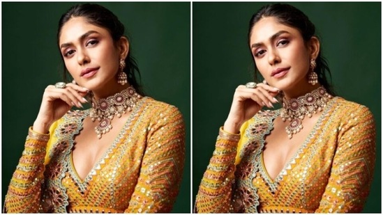 Mrunal looked ethereal in a yellow full-sleeved blouse with silver sequin and embroidery details. She teamed it with a yellow satin flowy skirt with tulle patterns, and added a yellow satin dupatta featuring silver zari work at the borders. (Instagram/@mrunalthakur)