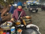 The image shows the woman who opened a chai stall in Dehi.