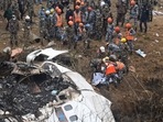 Rescuers carrying out operations at the plane crash site in Nepal's Pokhara on Sunday.(AFP) Rescuers carrying out operations at the plane crash site in Nepal's Pokhara on Sunday.(AFP)
