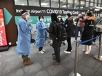 Health workers guide travellers arriving from China in front of a Covid-19 testing centre at Incheon International Airport, west of Seoul on January 3.(AFP) Health workers guide travellers arriving from China in front of a Covid-19 testing centre at Incheon International Airport, west of Seoul on January 3.(AFP)