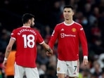 Bruno Fernandes (L) with Cristiano Ronaldo