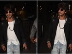 Shah Rukh Khan in a classic white tee and blue denim jeans at the airport. (HT Photo/Varinder Chawla) Shah Rukh Khan in a classic white tee and blue denim jeans at the airport. (HT Photo/Varinder Chawla)