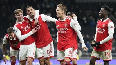 Arsenal players celebrate their victory at the English Premier League soccer match between Tottenham Hotspur and Arsenal at the Tottenham Hotspur Stadium (AP)