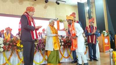 Governor Anandiben Patel and minister Surya Pratap Shahi felicitating students at the 24th convocation ceremony of Acharya Narendra Dev University, Ayodhya. (HT Photo)