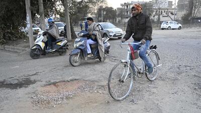 Gurugram, India-January 15, 2023: Badly damaged roads cause accidents and traffic congestion at Kadipur chowk near sector-10A, in Gurugram, India, on Sunday, 15 January 2023. (Photo by Parveen Kumar/Hindustan Times)(Pic to go with Leena Dhankar's story) Gurugram, India-January 15, 2023: Badly damaged roads cause accidents and traffic congestion at Kadipur chowk near sector-10A, in Gurugram, India, on Sunday, 15 January 2023. (Photo by Parveen Kumar/Hindustan Times)(Pic to go with Leena Dhankar's story)