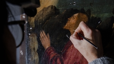 Restorer Valentina Piovan works on Vittore Carpaccio's 1502 painting 'The agony in the garden' at the Dalmatian School in Venice, northern Italy, (AP Photo/Domenico Stinellis) Restorer Valentina Piovan works on Vittore Carpaccio's 1502 painting 'The agony in the garden' at the Dalmatian School in Venice, northern Italy, (AP Photo/Domenico Stinellis)