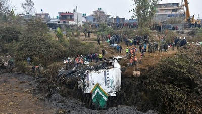 Rescuers inspect the wreckage at the site of a Yeti Airlines plane crash in Pokhara on January 16. (AFP) Rescuers inspect the wreckage at the site of a Yeti Airlines plane crash in Pokhara on January 16. (AFP)