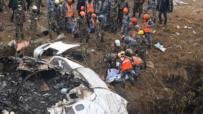 Rescuers carrying out operations at the plane crash site in Nepal's Pokhara on Sunday. (AFP)