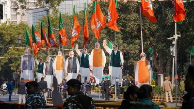 Cut-outs of PM Modi and BJP National President JP Nadda put up for a mega roadshow in Delhi. (PTI) Cut-outs of PM Modi and BJP National President JP Nadda put up for a mega roadshow in Delhi. (PTI)
