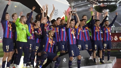 Barcelona players celebrate with a trophy after they won the final of the Spanish Super Cup between Barcelona and Real Madrid, in Riyadh, Saudi Arabia (AP) Barcelona players celebrate with a trophy after they won the final of the Spanish Super Cup between Barcelona and Real Madrid, in Riyadh, Saudi Arabia (AP)
