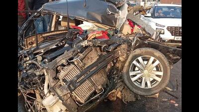 The mangled remains of the car that rammed into a parked stationary truck reportedly due to fog on the Ambala-Jagadhri highway on Monday. (HT Photo)