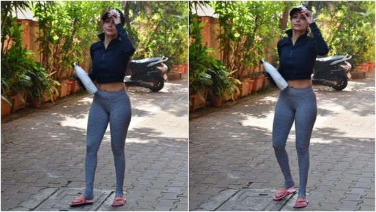 While the black-coloured jacket features a raised collar, front zip closure, full-length sleeves, midriff-baring cropped hem length, a fitted silhouette and ribbed detail on the borders, the yoga tights come in grey shade and have a bodycon fitting and a mid-rise waistline. (HT Photo/Varinder Chawla)