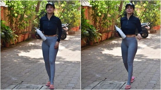 Malaika wore a grey and black-toned ensemble for the yoga session. Her workout look features a cropped jacket and yoga tights. (HT Photo/Varinder Chawla)