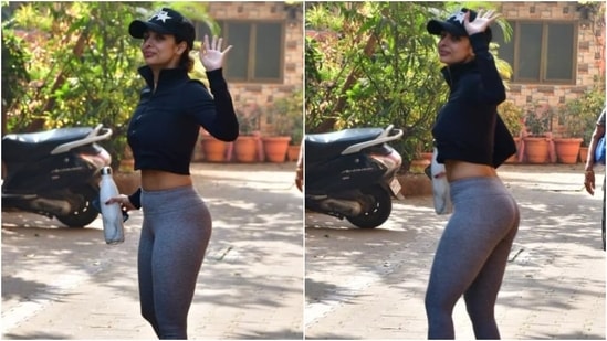 Flaunting her enviable frame in the workout outfit, Malaika styled the monochrome look with a black baseball cap and pink flip-flops. (HT Photo/Varinder Chawla)