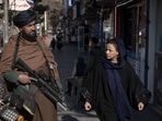 Taliban Women NGO Ban: A Taliban fighter stands guard in Kabul, Afghanistan. Taliban Women NGO Ban: A Taliban fighter stands guard in Kabul, Afghanistan.